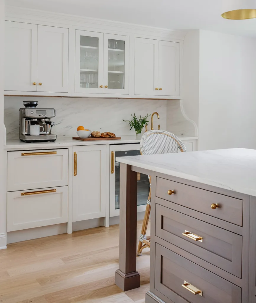 Kitchen with painted cabinets and dark stained island