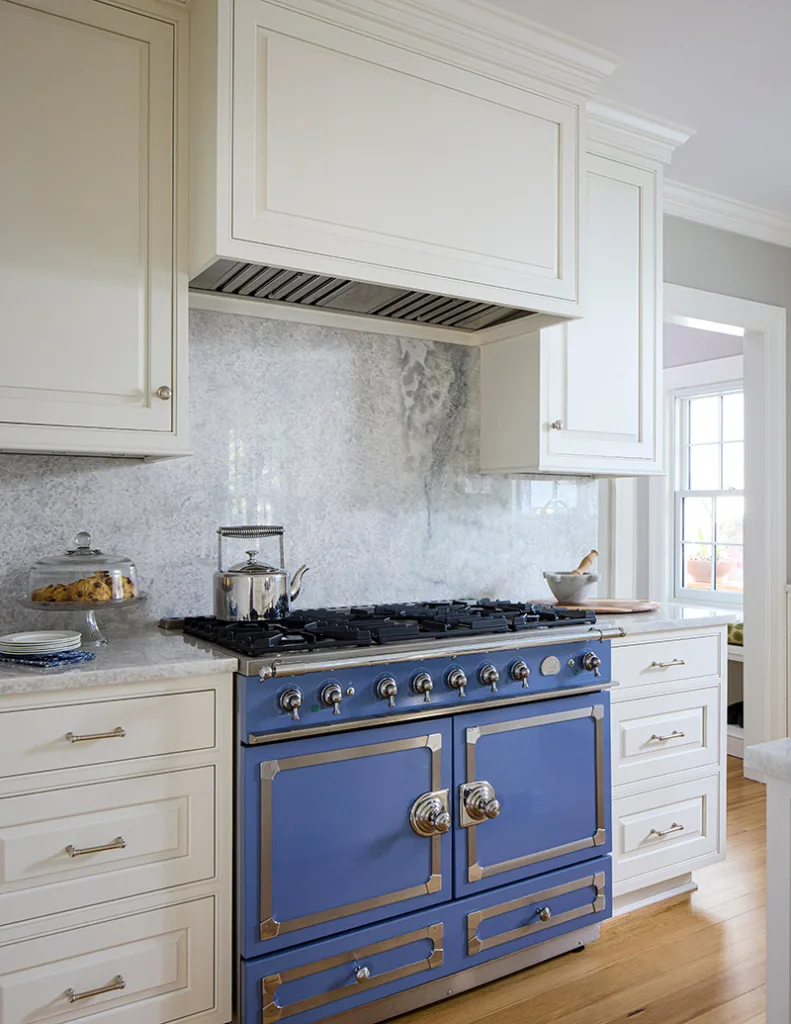 Blue stove with custom range hood
