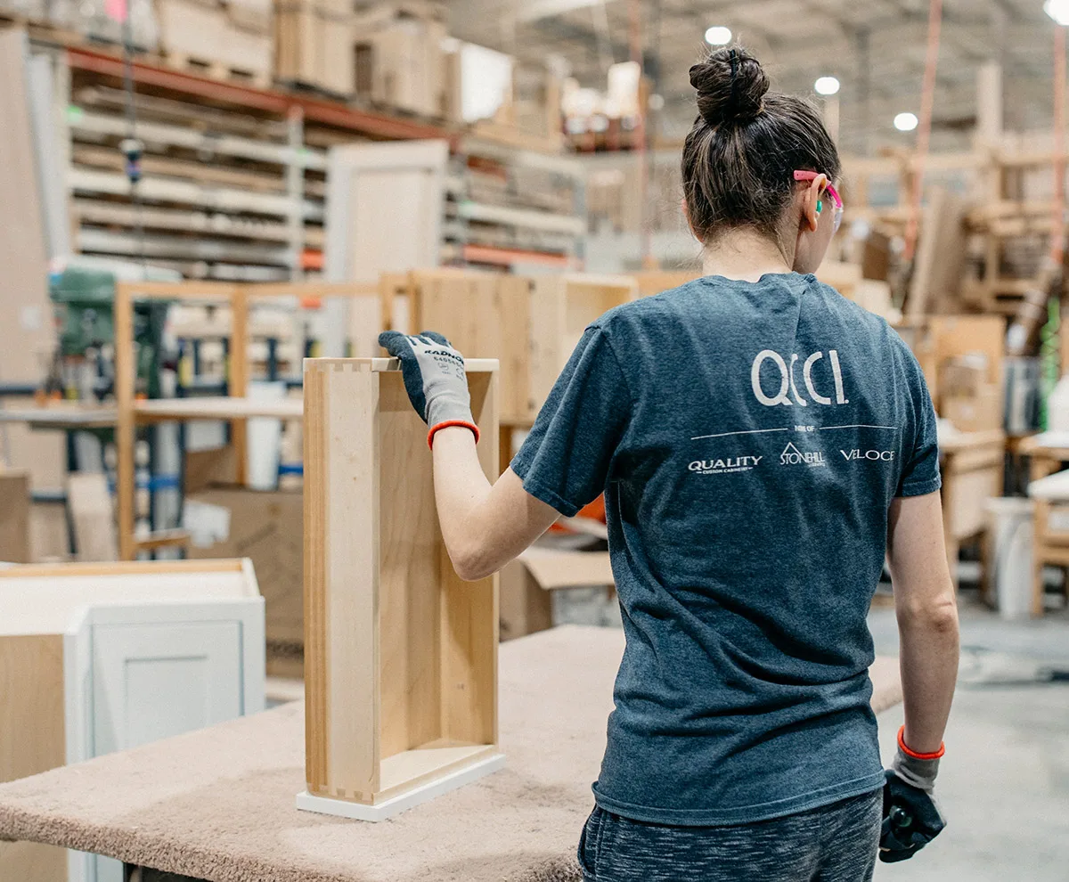 QCCI cabinet making employee
