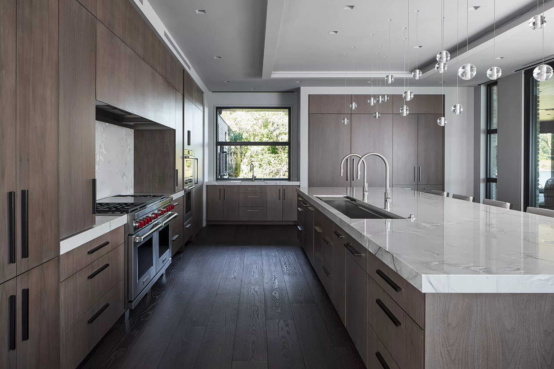 Custom high end kitchen cabinets in open-concept space with modern design