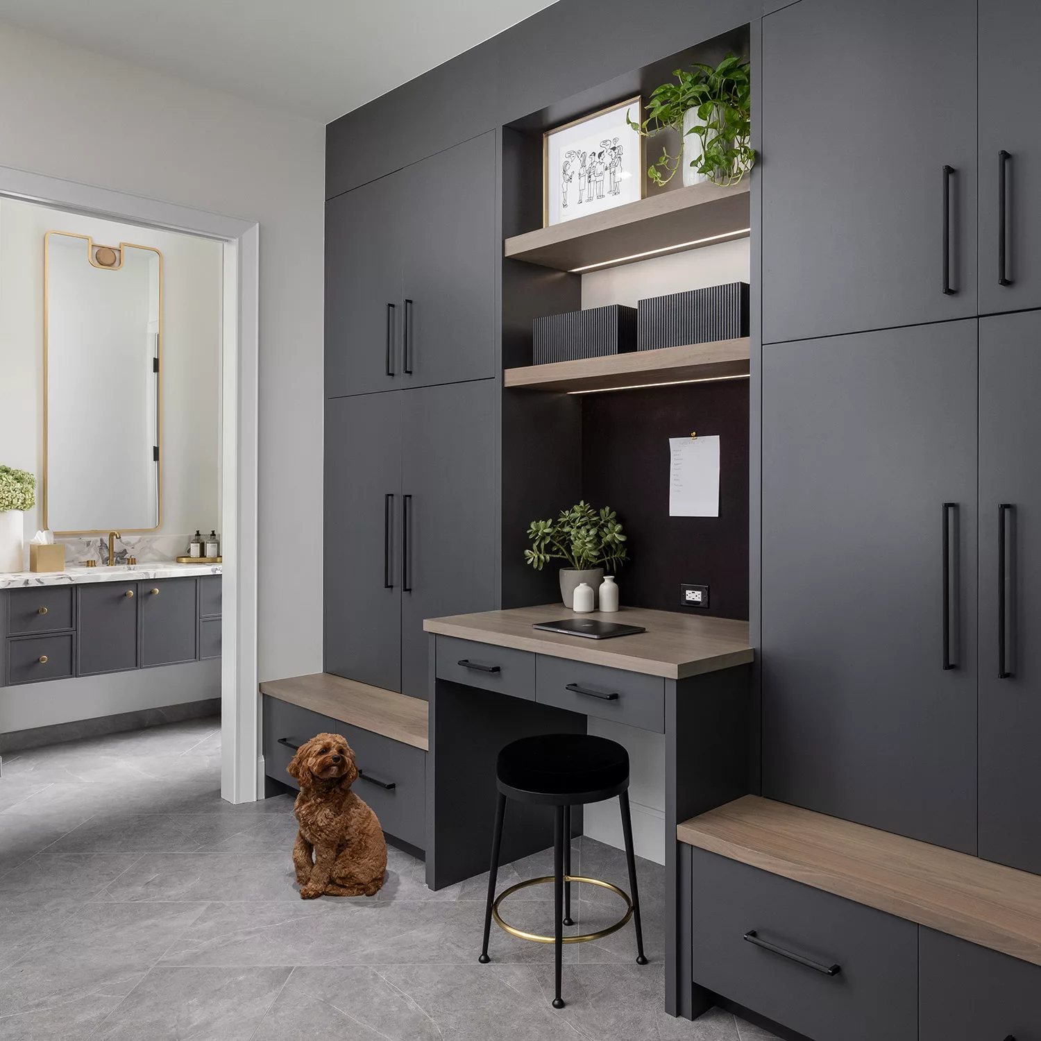 Home office with custom cabinetry, built-in desk, and file storage drawers