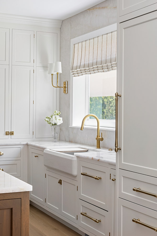 Kitchen with window and sink - shaker style doors in cabinets